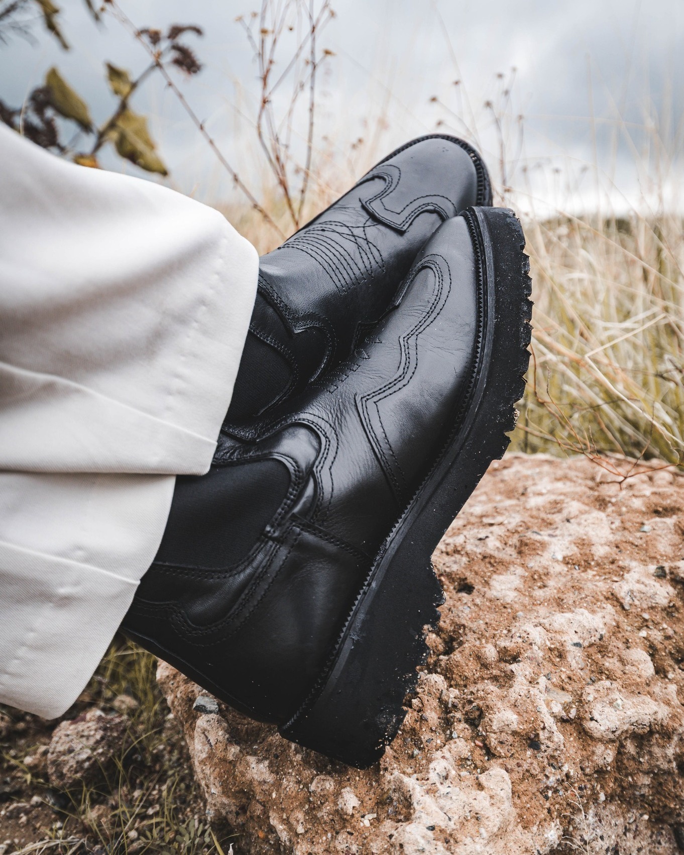 Roven Leather craftsmanship — polished leather shoes in an editorial scene