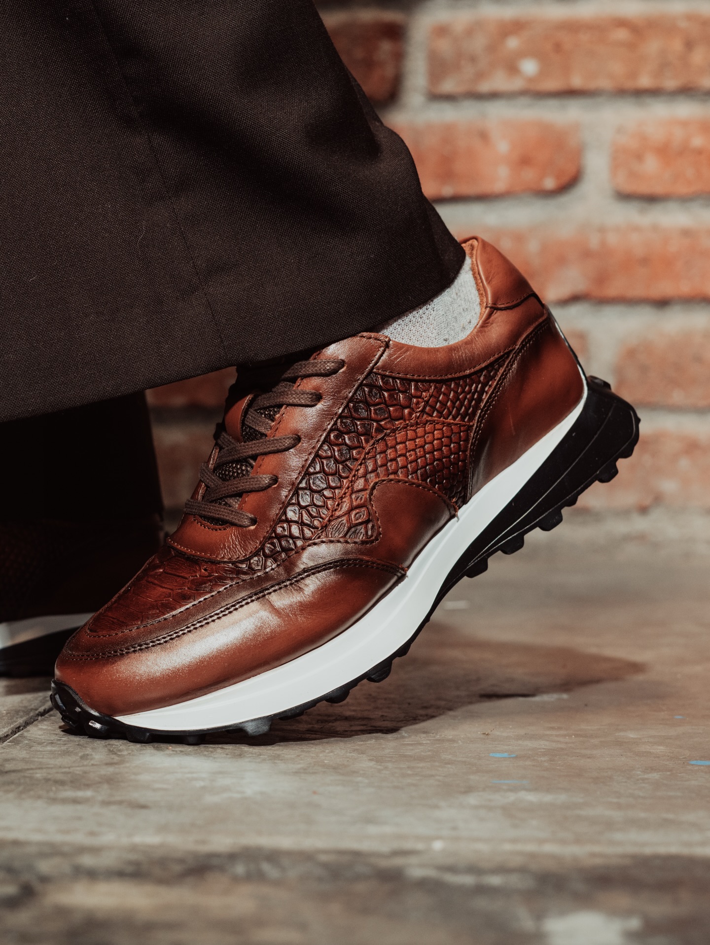 Luxury leather shoes photographed in an editorial studio composition
